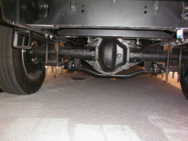 This is what looks to be a Dana 80 or larger rear end and you can just see the huge rear disc brakes that are part of the 4 wheel ABS system.  I almost got stepped on taking this picture, lol.