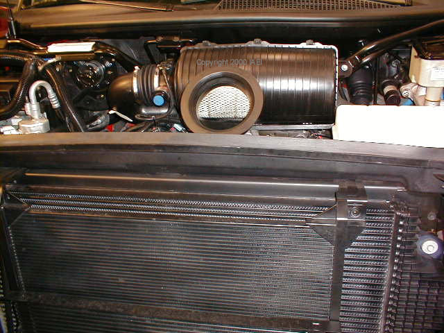 A Duramax lurks under here somewhere, as view from over the flip front end.